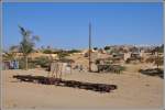 In Halib Mentel, dem ersten Dorf an der ehemaligen Eisenbahnstrecke von Keren nach Asmara, stehen auf dem Bahnhofsgelände noch zwei Güterwagen, die offenbar vergessen wurden.