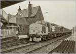 Die von Northern gemietet Class 37 mit der Nummer 37403 und Namen  Isle of Mull  hat mit ihrem Carlise  (ab 8:42) Barrow (an 11:30) - Service St Bees erreicht. Das Bild entstand nach dem öffnen der Schranken auf dem Bahnübergang und zeigt auch in Britannien typischen Bahnsteigabschlüsse.
27. April 2018