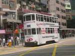 Eine Hogkonger Straenbahn mit englischer Werbung am 9.3.2008 in Wanchai