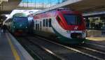 Zwei italienischen Personenzüge stehen in Roma-Ostiense(I) bei Schönem Sonnenschein am Mittag vom 29.12.2014.