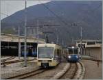 Unser, durch warten auf Anschlusszüge verspätete, Schnellzug D 43 CEX kreuzt den aus Locarno kommenden ABe 8/8  Roma  21 statt in Masera im Betriebsbahnhof der SSIF in Domodossla. 3. April 2014