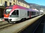 170 155-5 im Design des Landes Trentino als REX 1884 nach Fortezza/Franzensfeste im Bahnhof Lienz. (12.3.2015)
