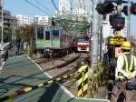 Fremde Züge auf der Keikyû-Linie: Die Chiba New Town–Bahn.