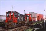 CN SW-1200 RM 7312 und 7316 ziehen einen Containerzug aus dem Hafen Halifax in den Rockingham Yard. (Archiv 07/1998)