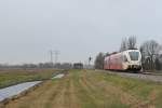 Spurt 10314 “Jopie Huisman” (Arriva) mit Regionalzug 37827 Groningen-Veendam bei Waterhuizen am 3-1-2013.

