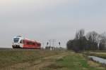 Spurt 10304 “Hans Alders” (Arriva) mit Regionalzug ARR 20137 Groningen-Veendam bei Waterhuizen am 3-1-2013.

