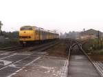 Eine qualmende 113 mit Regionalzug 6135 Tiel-Arnhem Velperpoort bei Kesteren am 18-8-1998.