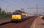 NS 1143 mit Int-207 ( Colonia Expres , Hoek van Holland Haven - Köln Hbf) bei der durchfahrt in Blerick am 04.07.1991, 10.04u.