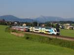 Ein Westbahn KISS nach Freilassing und der 5047 075, der 5047 088, der 5047 070 und der 5047 076 als REX nach Braunau am 04.06.2014 unterwegs bei Weng.