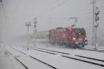 1016 040 zieht am 30.01.2015 EC164 bei dichtem Schneefall durch den Bahnhof Mixnitz-Bärenschützklamm.