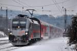 Railjet Prototyp 1016 035 mit einem REX nach Amstetten bei der Einfahrt auf dem  falschen  Gleis in Tullnerbach-Pressbaum. (12.2.2010)