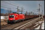 1116 103 mit Güterzug fährt am 1.03.2018 durch die Haltestelle Kapfenberg Fachhochschule.