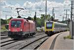 ÖBB 1116 184 für IC186 nach Stuttgart und IRE3070 mit 612 521 nach Basel Bad Bf in Singen (Htwl). (16.07.2018)








