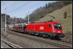 1116 148 mit Güterzug bei Bruck - Mur am 5.03.2020.