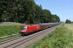 1116 275 mit einem  Railjet  aus Salzburg kommend am 18. Juni 2024 bei Hufschlag/Traunstein.