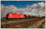 Habe ich beim Himmel bertrieben? 1116 242 am 15.2.2008 bei der Durchfahrt in Gramatneusiedl Richtung Westen. Es handelt sich vermutlich hier um einen Getreidezug.