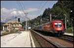 1116 097 schiebt den REX 1509  betriebliche-altersvorsorge.at , Innsbruck Hbf - Schwarzach-St.Veit, aus dem Bahnhof Kitzbhel. (02.08.2009)