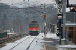 1142 615 verlt mit R 2023 den Bahnhof in Tullnerbach-Pressbaum in Richtung Wien Westbahnhof.