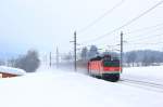 BB 1144 082 unterwegs mit einem Turnuszug bei Fieberbrunn am 12.02.12.