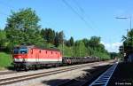 BB 1144 268-0 vor Ganzzug Flachwagen mit Drathrollen Richtung Rosenheim, KBS 950 Mnchen - Kufstein, fotografiert bei Durchfahrt Bhf.