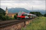 4024 057 ist als RB 5122 von Telfs-Pfaffenhofen nach Rosenheim unterwegs und wird vor dem Kloster Raisach abgelichtet.