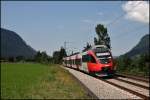 4024 086 legt sich als R 5121 nach Telfs-Paffenhofen in die Kurve. (05.08.2009)