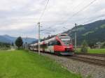 4024 085-5 mit S6 5015 Wrgl Hauptbahnhof-Hochfilzen bei Brixen im Thale am 11-8-2010.