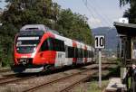 4024 030-1 fhrt als REX aus Bludenz kommend in Krze auf den Lindauer Bahndamm, 12.08.11