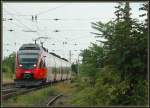 Triebwagen der Reihe 4024 am 15.8.2006 kurz vor der Einfahrt in die S-Bahnstation Atzgersdorf-Mauer in Wien.