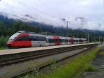 4024 104-4 als R 4855 (Lienz - Spittal-Millstättersee) am 17.8.2015 bei der Abfahrt in Greifenburg-Weißensee.