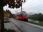 2024 097-0 als R 4260 (Lienz - Friesach) am 13.10.2015 bei der Abfahrt in Berg im Drautal.