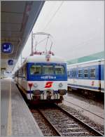 Der ÖBB 4030 310-9 wartet am 30 Mai 1995 in Bregenz auf die Abfahrt nach Lindau Hbf. 
 