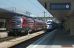 1116 205 und ein 411er stehen am 06.August 2013 in Wien Westbahnhof.