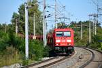 Deutsche Bahn-DB 185 379 mit einem leeren Autotransportwagenzug am 20.09.2023 in Lanzendorf-Rannersdorf Richtung Ungarn