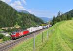 1293 036 mit einer ROLA nach Brennersee Terminal am 27.07.2024 bei Wolf am Brenner.