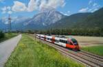 In herrlicher Sommeratmosphäre war der noch mit  S-Bahn-Vorarlberg -Beschriftung verkehrende 4024 026-9 am 30.07.2020 bei Flaurling als S2 5158 auf dem Weg nach Ötztal.