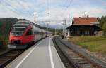 4024 091-3 als S5 der Tiroler Schnellbahn verlt am 4.10.2012 am spteren Nachmittag mit Ausgangspunkt Seefeld in Tirol die Haltestelle Reith auf der Fahrt nach Innsbruck.