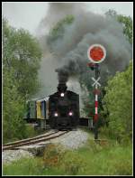 Der  Stainzer Flascherlzug  kurz nach der Ausfahrt aus dem Bahnhof Preding im Bezirk Deutschlandsberg am 13.5.2006. Bei der Lok, die zur Zeit im Einsatz ist, handelt es sich um die ehemalige rumnische Waldbahnlokomotive 764.411 Model Resita Nr. 619 BJ 1986.