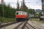 Die ehemalige BB, nunmehrige NVOG 1099 002 fhrt am 25.August 2012 mit dem Wagensatz REX6814  Dirndltaler  in den Bf. Mitterbach ein.