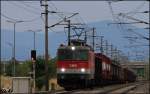 1144.071 mit Gterzug am 20.08.13 auf Hhe der Einfahrgruppe von Wr.Neustadt.