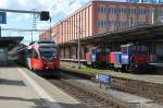 Ein Zug der S-Bahn Vorarlberg nach Bregenz in St.Margrethen.Rechts zwei 232er cargo Rangierloks.St.Margrethen 13.04.13