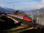 Die Re 420 299 mit einem EC nach Graz am 18.02.2017 unterwegs bei Unterterzen.