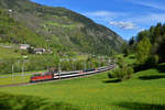 Re 4/4 11164 mit einem IR am 20.05.2016 bei Ambri. 