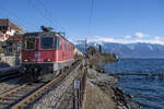 Re 420 325-3 ist unterwegs in Richtung Lausanne, aufgenommen bei der Durchfahrt in St.