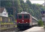 Re 4/4 II 11149 fhrt mit einem REX nach Chur durch Staad am Bodensee.