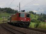 Die Re 4/4 11203 mit einem IR am 27.06.2009 unterwegs bei Arth-Goldau.