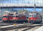 Re 4/4 II 11256, 11215 und RBe 540 031-2 in Chur.