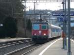 SBB - Re 4/4 11159 vor einem IR bei der einfahrt im Bahnhof Hezogenbuchsse am 02.01.2010 um 14:41:58, Belichtungsdauer: 0.005 s (10/2000) (1/200), Blende: f/4.0, ISO: 100, Brennweite: 31.30 (313/10)  