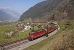 SBB Re4/4'' 11177 + Re6/6 11641 hauling a freight train start to rise up the northern side of the Gotthard, just after Erstfeld on the 17th of April in 2010