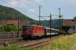 Re 4/4 II 11141 am 28.06.2011 mit einem Interregio in Tecknau